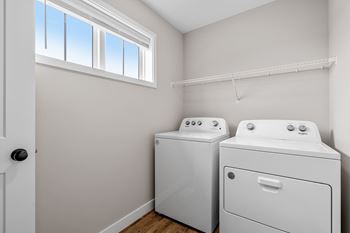 A laundry room with a washer and dryer.